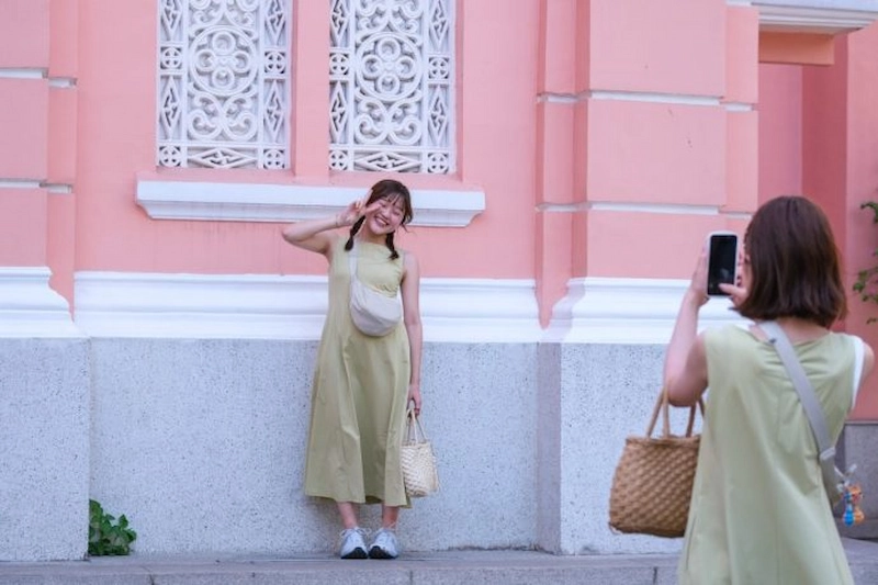 Tourists enjoy taking photos at the church